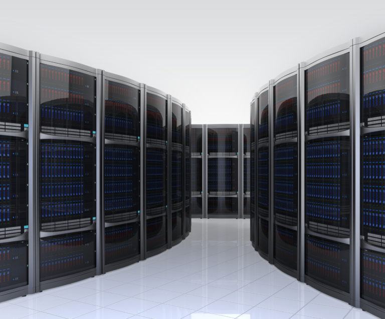Modern data center aisle with rows of server racks and illuminated panels.